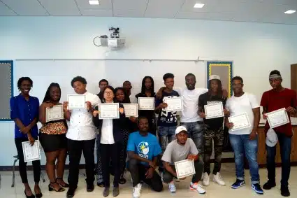 Solar Works DC participants pose with their graduation certificates