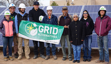 GRID staff and volunteers celebrate the completed installations with the Tesque Pueblo homeowners.