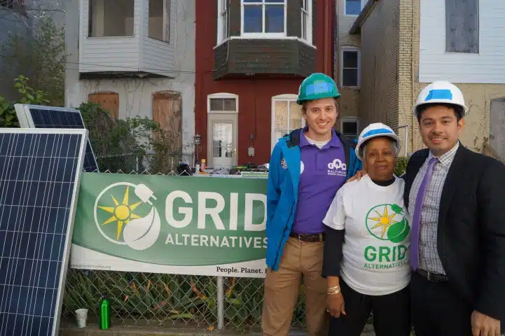 Tom with Civic Works, Homeowner Ms. Williams, and Albert with GRID