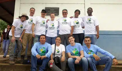 Trojan employees and GRID staff posing for a photo