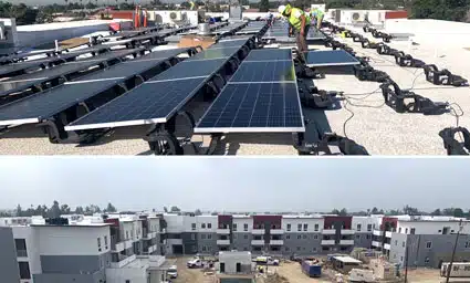 Solar panels installed on rooftop and residential buildings under construction at VistaVerde