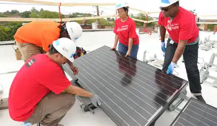 Volunteers install a panel on a home in the Ivy City neighborhood of Washington, D.C. helping to launch GRID's work in the Mid-Atlantic region in fall 2014.