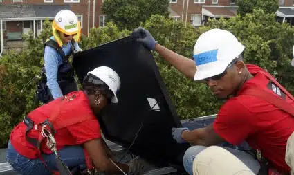 Wells Fargo volunteers install a solar panel