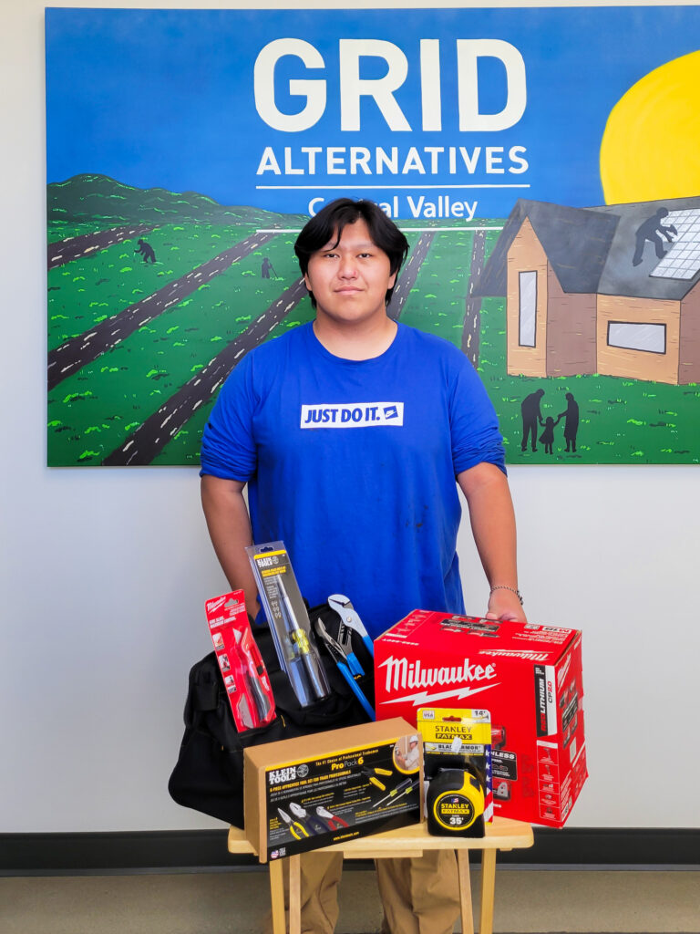man posing for photo with tools