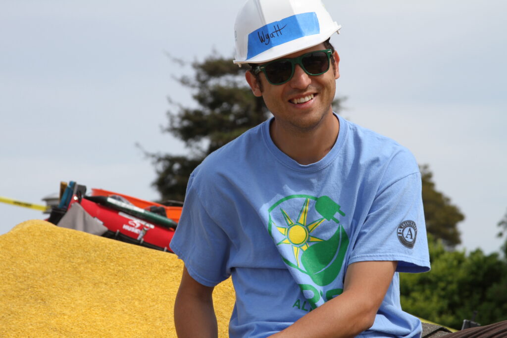 Wyatt Atkinson smiles while at an GRID install