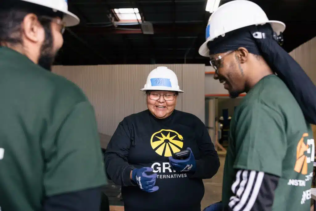 GRID staff and trainees working together in a workshop.