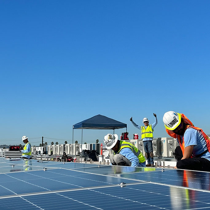 Construction crew installing commercial solar