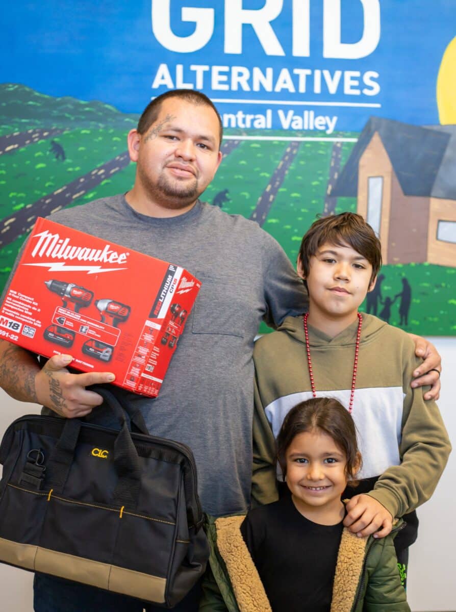 Michael Morales receiving his solar installation tools.