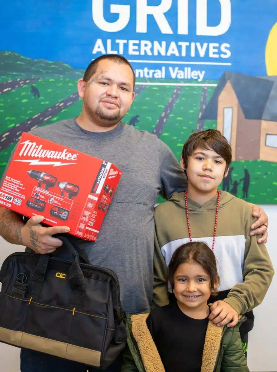Michael Morales receiving his solar installation tools.