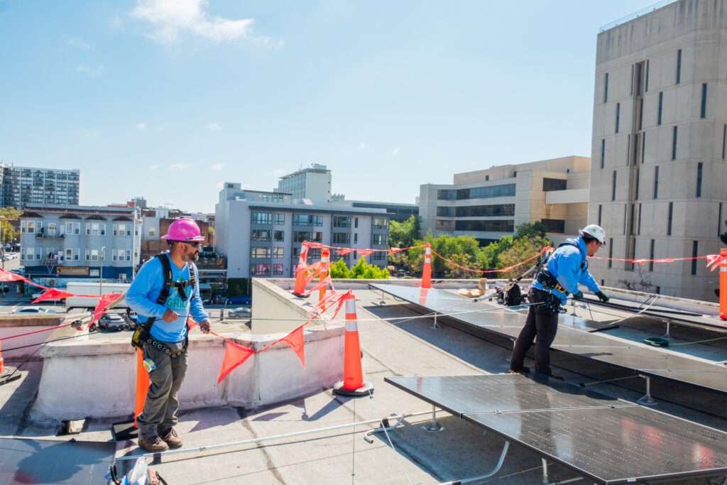 GRID installers run a cable across the roof