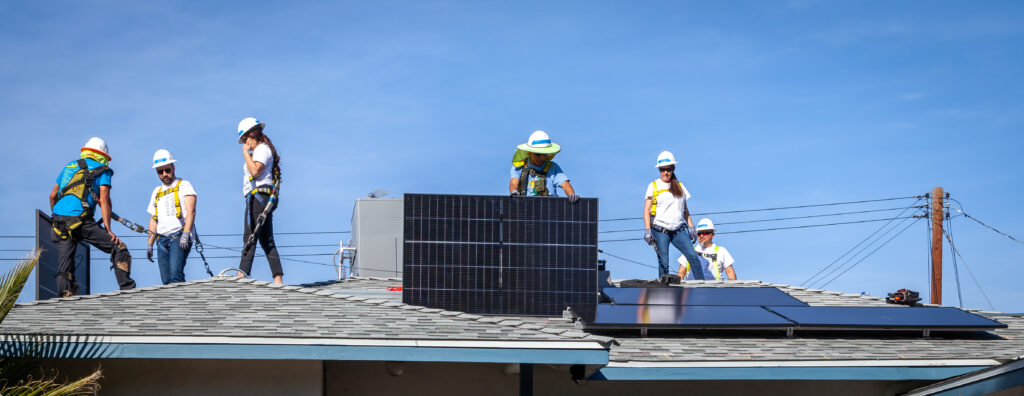 Solar panels being installed on Rey's house.