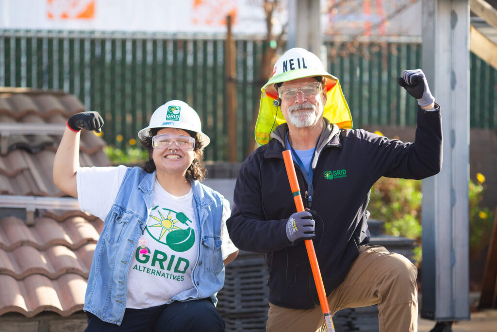 People smiling with hard hats