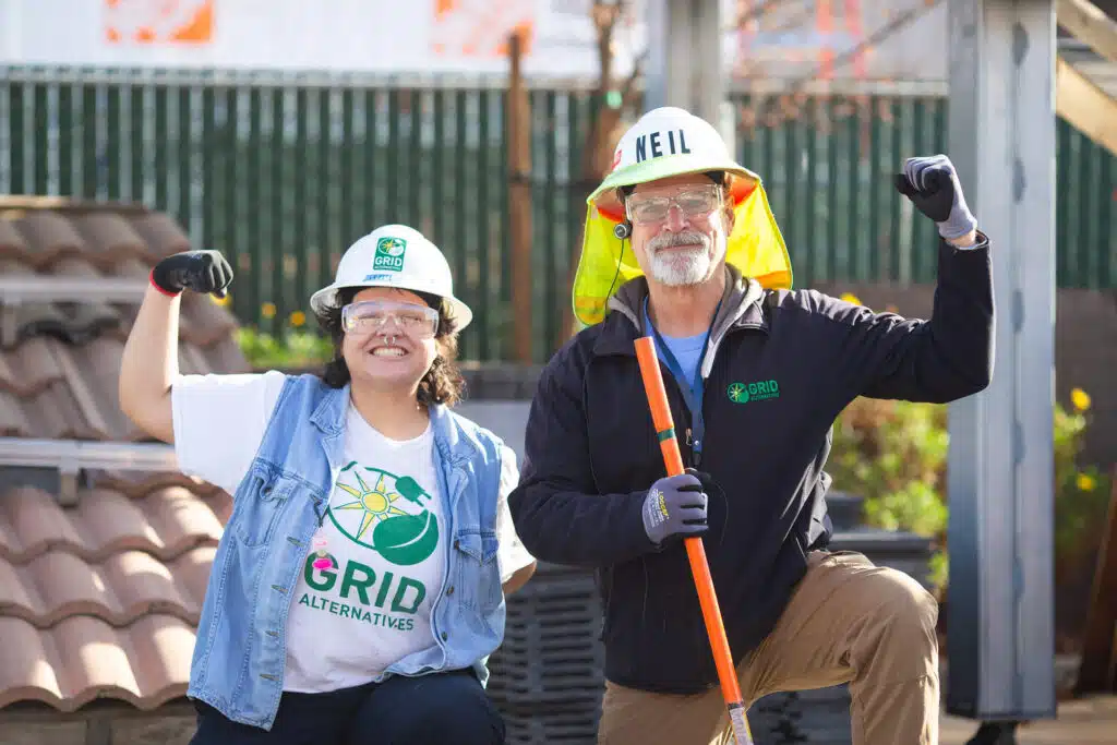 People smiling with hard hats