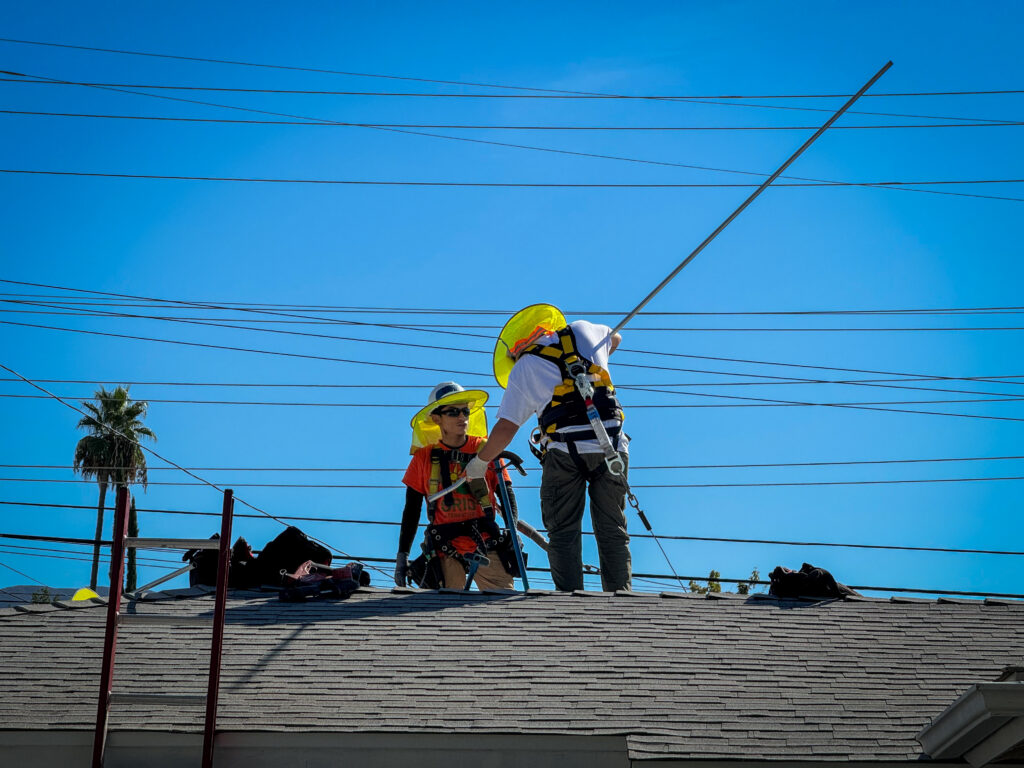Rio bending conduit on a roof at an IBT 200 single-family install training day.
