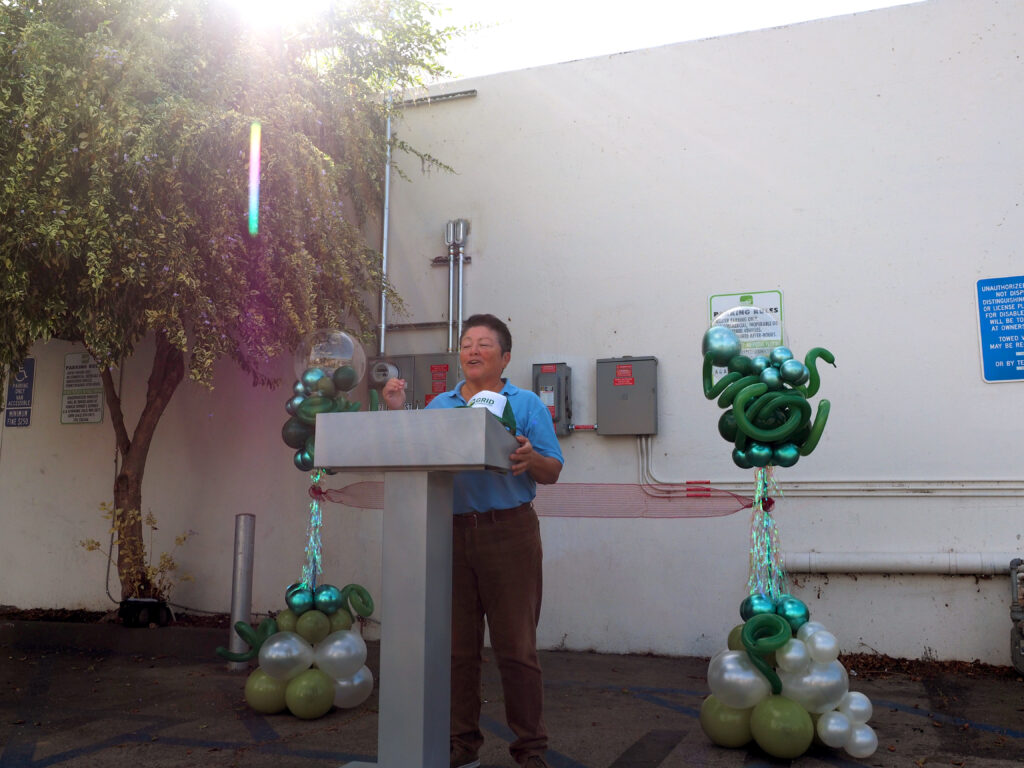 Senior Programs and Partnership Manager Stella Ursua speaks at the LGBTQ Center Long Beach Ribbon Cutting